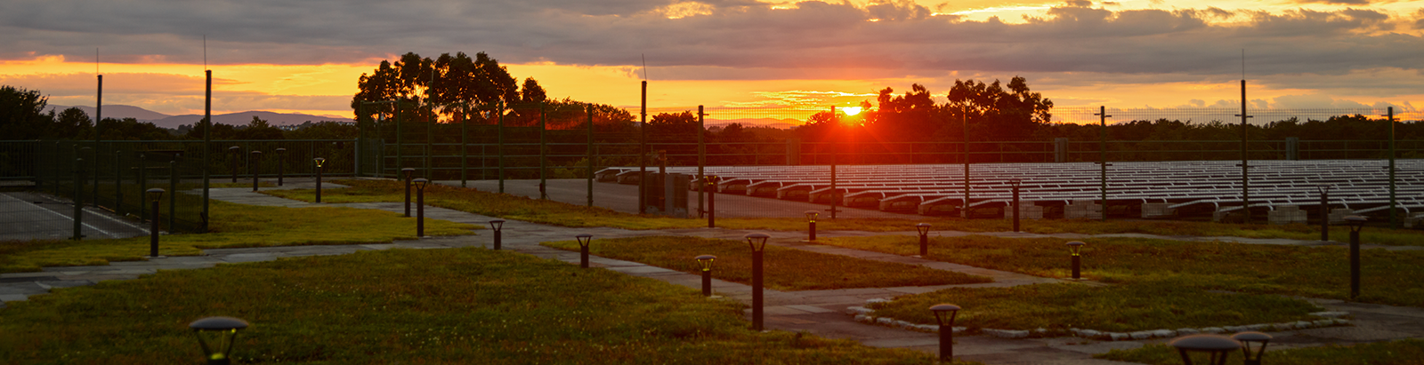 Sunset on the airport garage, solar panels, and rooftop garden at Leahy BTV.